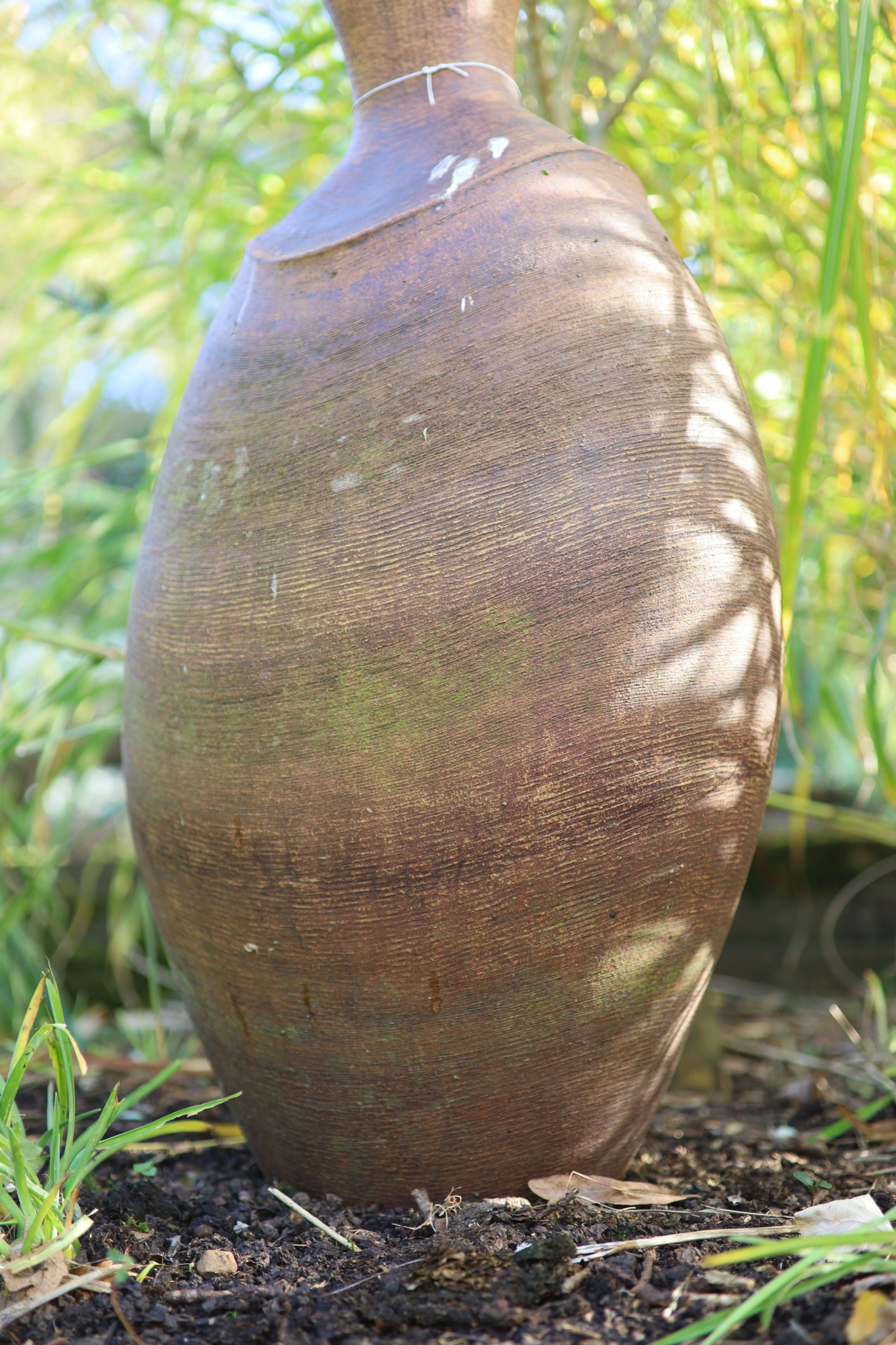 A terracotta garden urn ornament, height 86cm